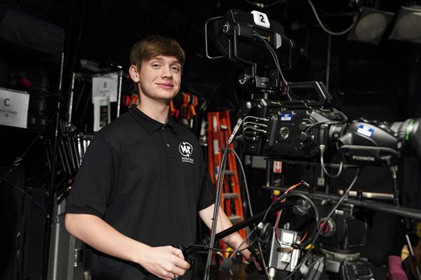 MULTIMEDIA TECHNOLOGY students working with cameras